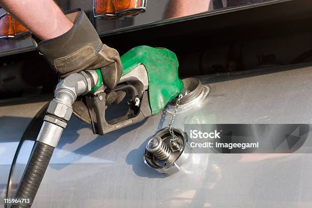 A Man Fuelling Up A Freight Transport Truck Stock Photo - Download Image Now - Diesel Fuel, Fuel Pump, Truck