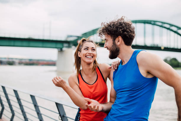 istock Smiling couple resting after exercise 1159648135