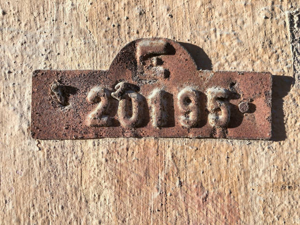 istock Old and rusty door number hanged on wall 1159648495