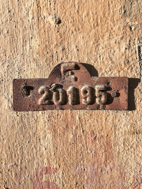 Old and rusty door number hanged on wall