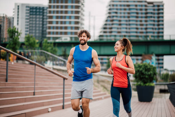 istock Woman running with trainer 1159648684
