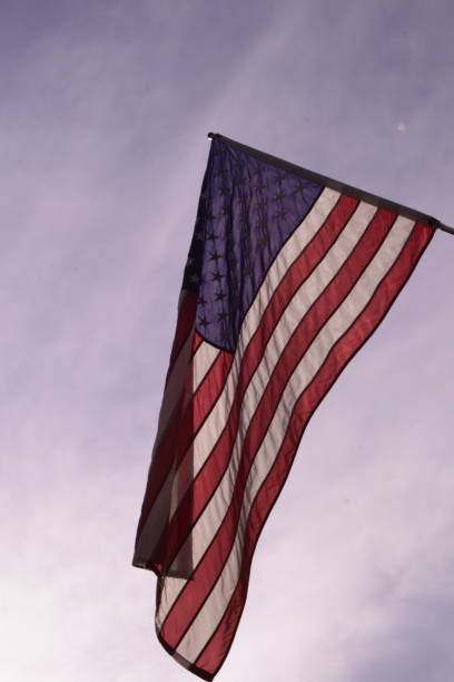 istock United States Flag Against Cloudy Morning  Sky 1159649913