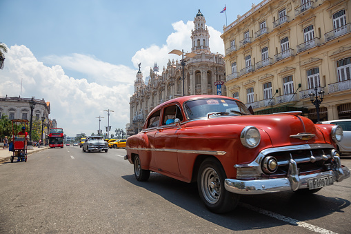Havana, Cuba - May 19, 2019: Classic Old American Car in the streets of the Old Havana City during a vibrant and bright sunny day.