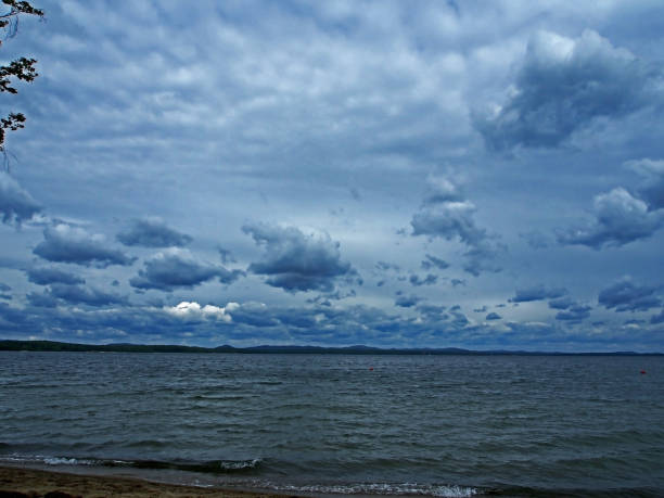 istock heavy gray clouds over the lake on a cloudy evening 1159651853