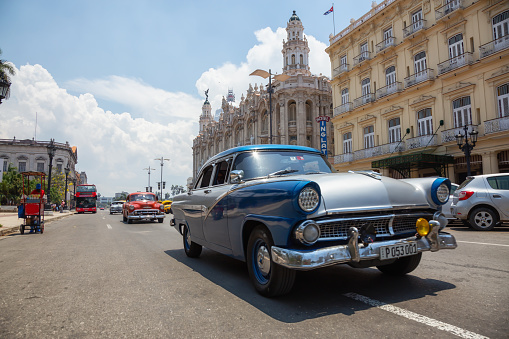 Havana, Cuba - May 19, 2019: Classic Old American Car in the streets of the Old Havana City during a vibrant and bright sunny day.