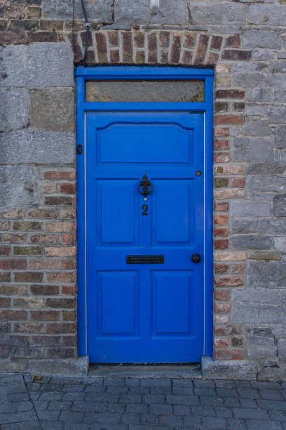 Blue door on the house in the UK Blue door on the house in the UK blue front door stock pictures, royalty-free photos & images