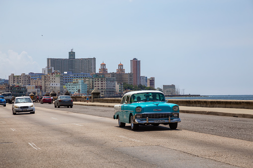 Havana, Cuba - May 19, 2019: Classic Old Car in the streets of the Old Havana City during a vibrant and bright sunny day.