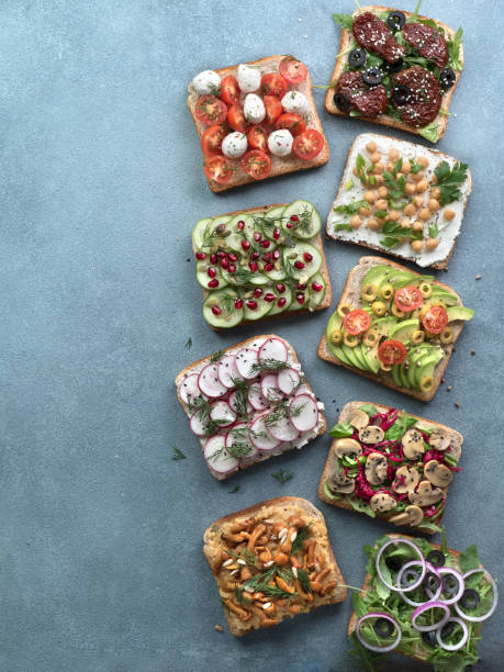 istock Assortment vegan sandwiches on gray stone background 1159653994