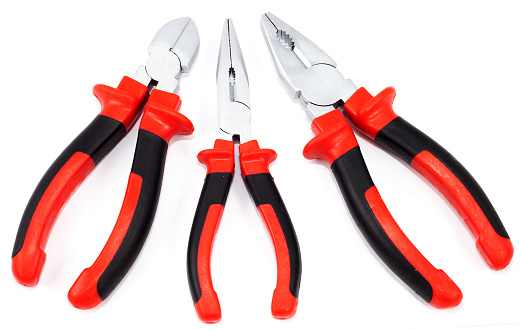 Set of three different types of pliers and side cutters