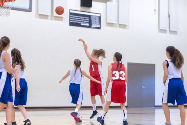 istock Elementary girls basketball practice 1159658335