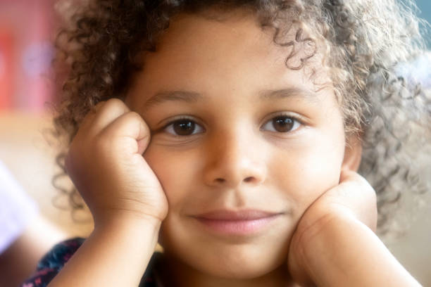 Mixed race Smiling little girl looking at the camera