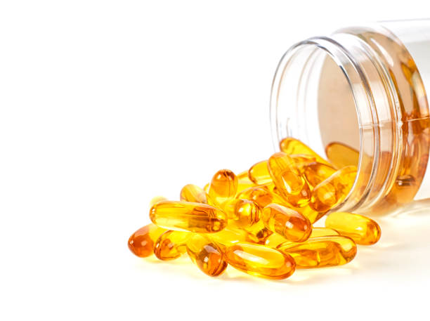 istock Omega 3 capsules from Fish Oil on white background. Vitamin D on white background. 1159658414