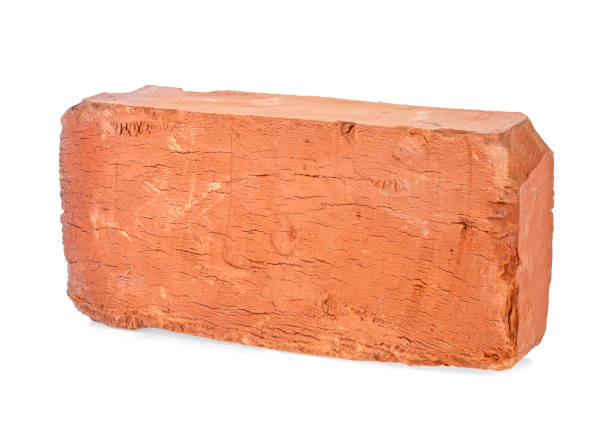 istock Old red brick isolated on a white background, closeup. Full depth of field. 1159658444