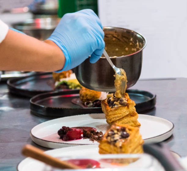 istock Chef preparing food in the kitchen, chef cooking 1159659111