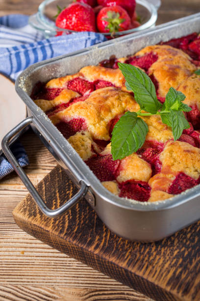 istock Yeast cake with strawberry in a mold. 1159659764
