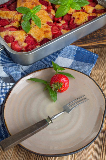 istock Yeast cake with strawberry in a mold. 1159659806