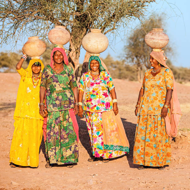 istock Indian women carrying water, Rajasthan 1159659843