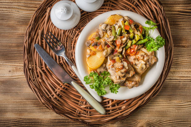 istock Fillet of chicken legs with stewed vegetables. 1159660731