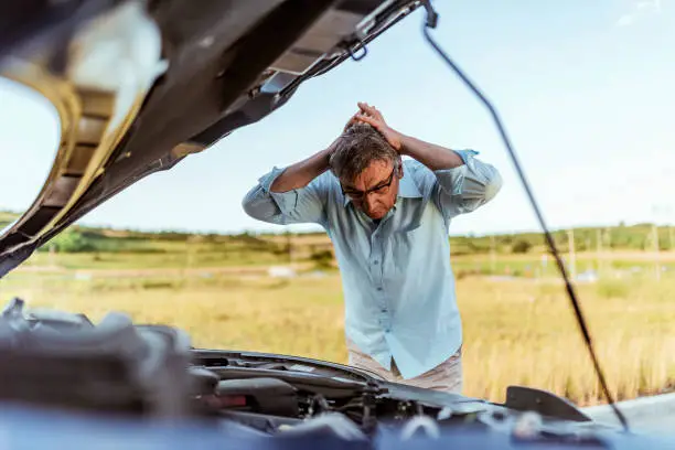 Photo of Angry man checking his car