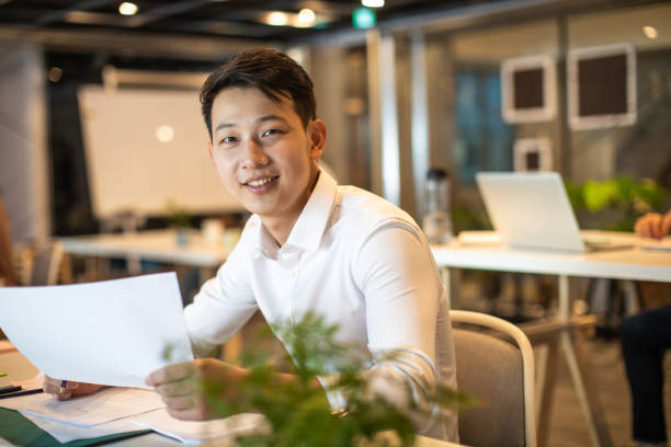 istock Portrait of young Taiwanese architect at work 1159664380