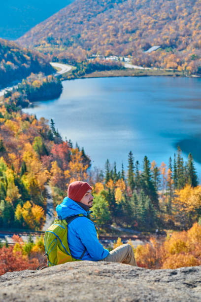 istock Backpacker man at Artist's Bluff in autumn 1159664454