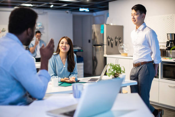 istock Multi-ethnic Group of business persons in discussion 1159664552
