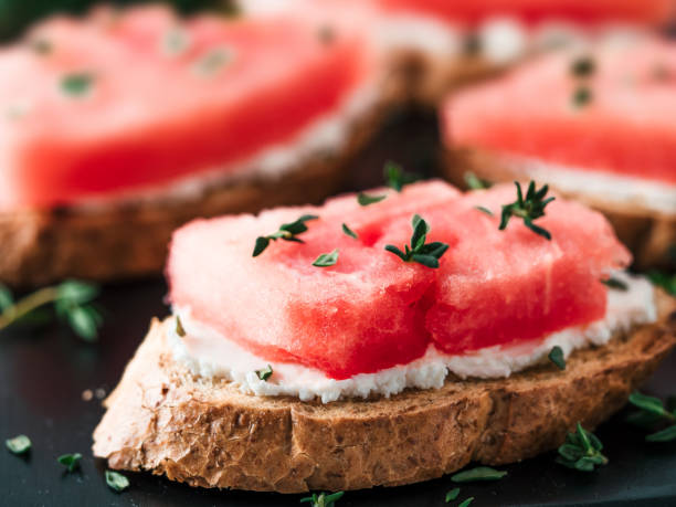 istock Toasts with watermelon, soft cheese and thyme 1159664777