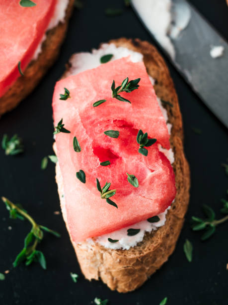 istock Toasts with watermelon, soft cheese and thyme 1159664796