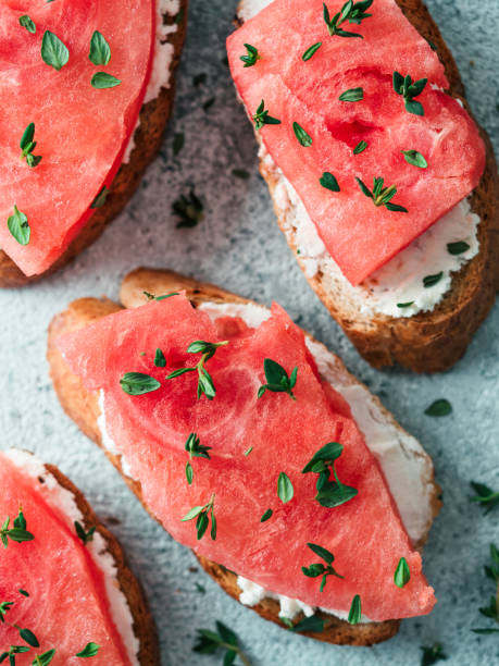 Toasts with watermelon, soft cheese and thyme