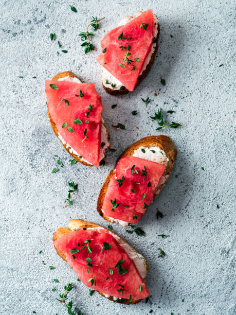 istock Toasts with watermelon, soft cheese and thyme 1159665009