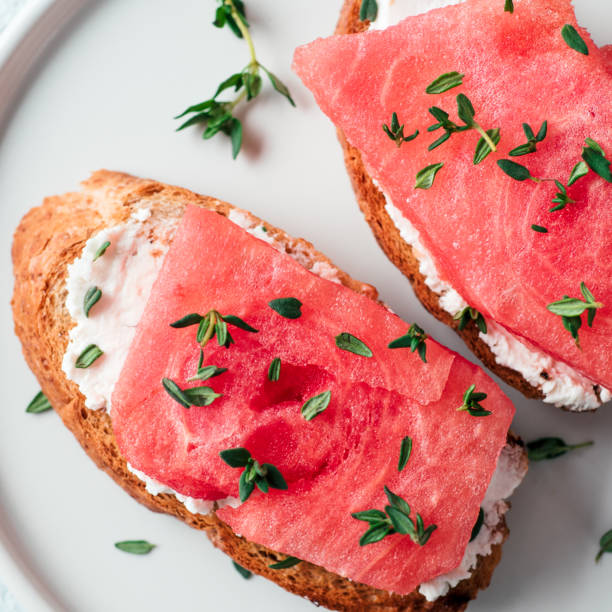 istock Toasts with watermelon, soft cheese and thyme 1159665043