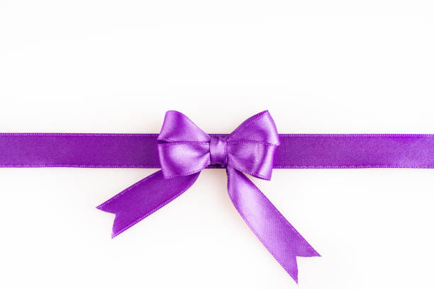 istock purple ribbon bow 1159666774