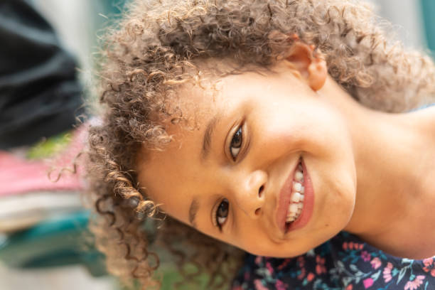 istock Smiling little girl looking at the camera 1159668187
