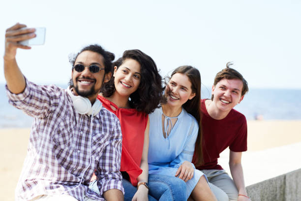 istock Friends taking Selfie at Beach 1159669232