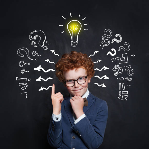 istock Smart kid pupil with lightbulb. Brainstorming and idea concept 1159669342
