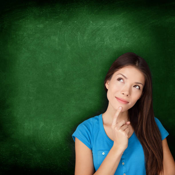 istock Thinking woman student or teacher with blackboard 1159671326