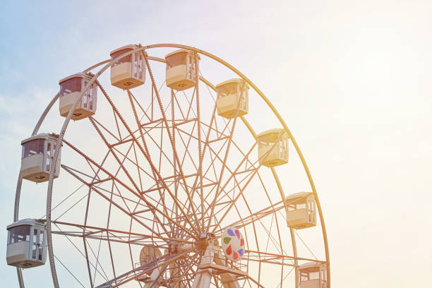 istock Ferris wheel carousel over sky with a sunlight 1159672287