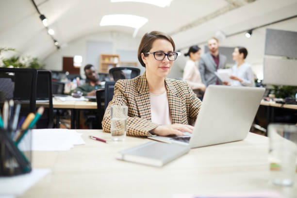 istock Confident Businesswoman Working in Open Space Office 1159672454