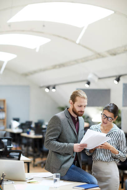 istock Businessman Discussing Documents with Colleague 1159672510