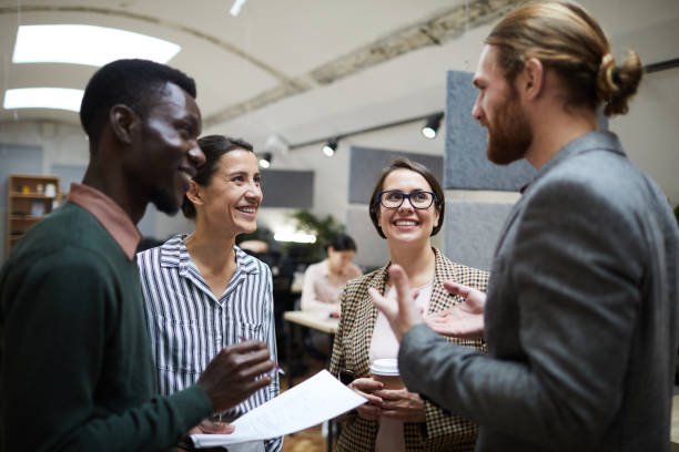 istock Business People Laughing at Coffee Break 1159672519