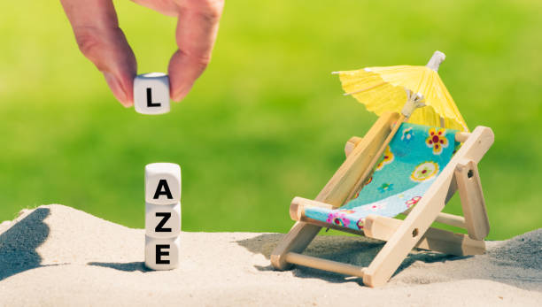 istock Dice placed next to a beach chair form the word 