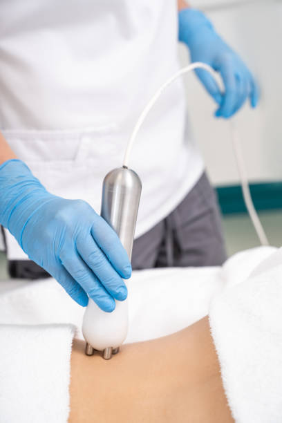 istock Close up of roller massager in doctor's arms 1159676238