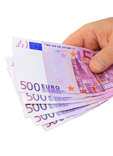 Hand holding euro notes (clipping path included) stock photo