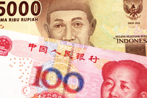 istock An Indonesian rupiah bank note with a Chinese one hundred yuan bill 1159677861