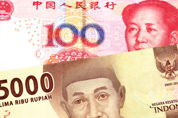 istock An Indonesian rupiah bank note with a Chinese one hundred yuan bill 1159678414