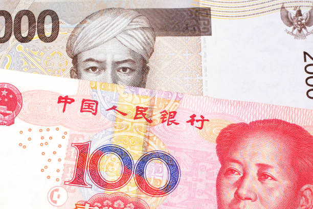 istock An Indonesian rupiah bank note with a Chinese one hundred yuan bill 1159678466