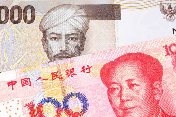 istock An Indonesian rupiah bank note with a Chinese one hundred yuan bill 1159678663