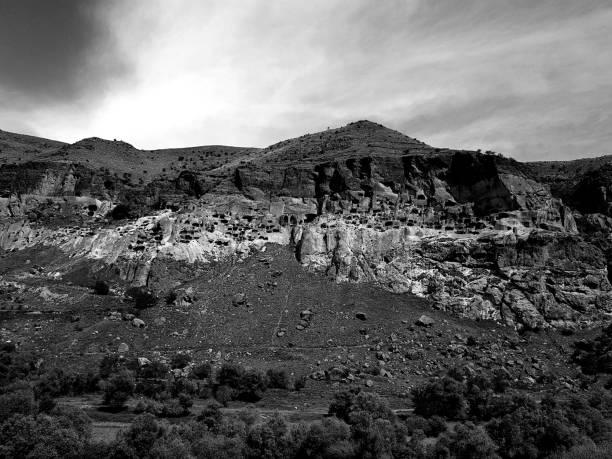 istock Black and white view of Vardzia monastery complex, Mtkvari river, Georgia 1159679433