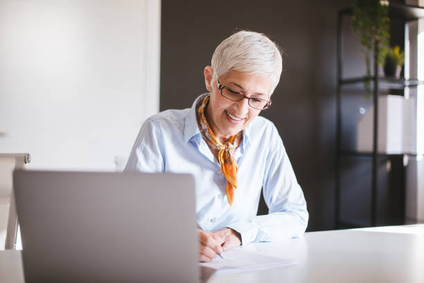 istock Senior businesswoman working at office 1159681697