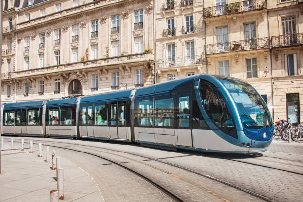 modern tramway in bordeaux, france - blurred motion street car green imagens e fotografias de stock